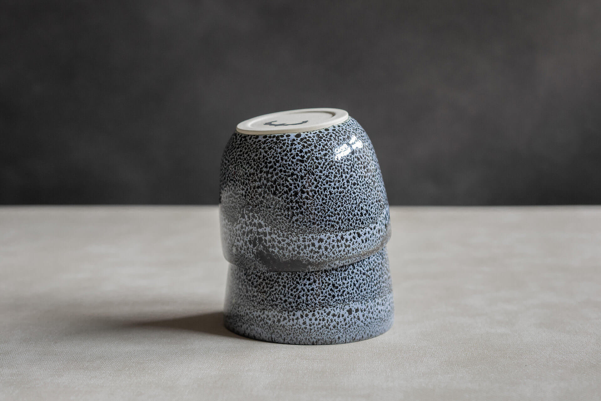 double stacked upside down sipping buddy on a marble textured surface